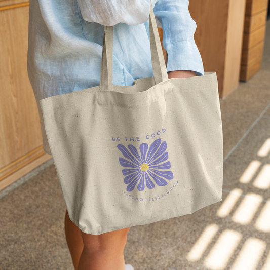 Canvas_Tote_-_Be_the_Good_-_Periwinkle_CottonTote_L_WomanDigging_Mockup.png