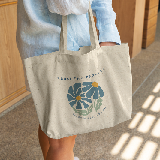 Canvas_Tote_-_Trust_the_Process_CottonTote_L_WomanDigging_Mockup.png